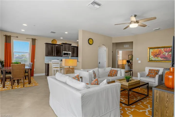 Open Great room, kitchen, dining space offers lots of natural light and tile flooring throughout the entire home (no carpet).