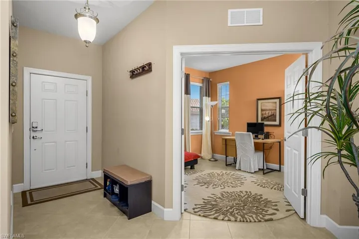 Open Foyer entry and french doors leading to den/office.