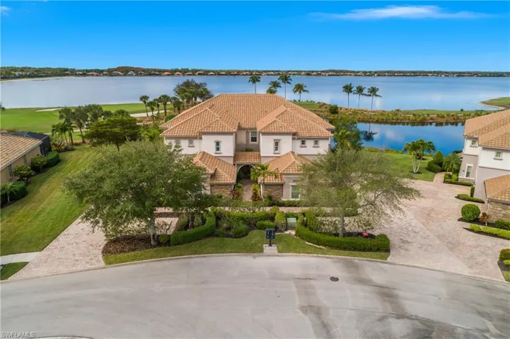 Spacious two car garage, first floor entry, oversized lanai, and stunning views from this turnkey unit... simply pack your suitcase and move in!