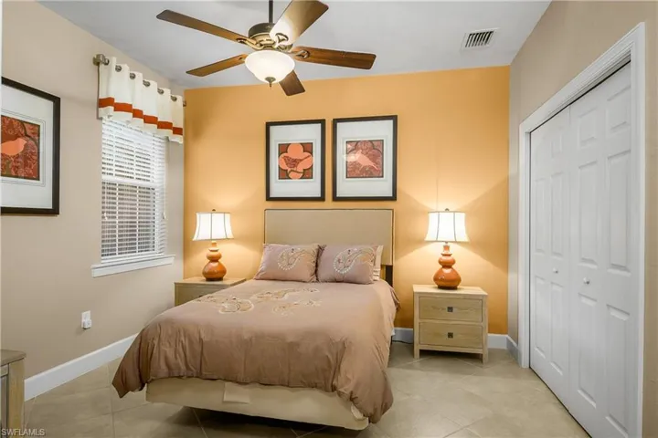 Guest bedroom is at the opposite side of the home giving guests their own private space and includes a dedicated bath nearby.