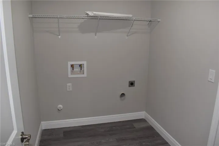 Laundry room with wood-type flooring, electric dryer hookup, washer hookup, and hookup for a gas dryer