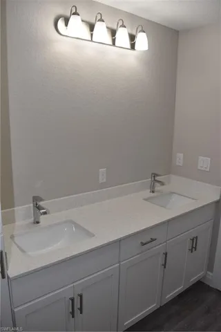 Bathroom featuring vanity and hardwood / wood-style flooring
