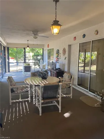 Enjoy Florida breezes on the lanai. Wonderful area to relax, read or play gamnes or cards.