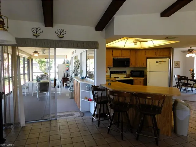 Large, in screened Lanai with entry to Family room, Living room and Master Bedroom