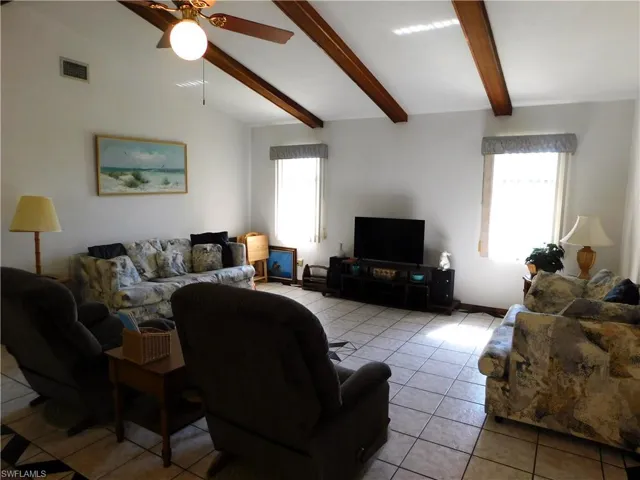 The Family room has vaulted ceilings and plenty of comfortable seating for everyone