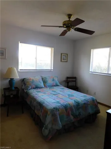 Rear Guest carpeted bedroom with ceiling fan
