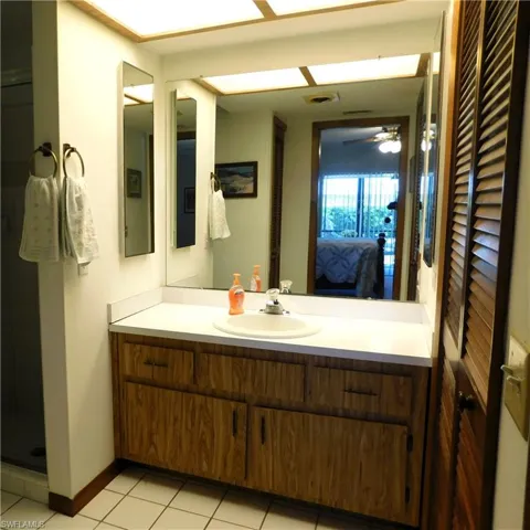 Master bath features single vanity and walk in shower