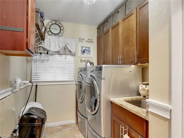 Efficient laundry room with washer and dryer included.  Lots of extra storage space.