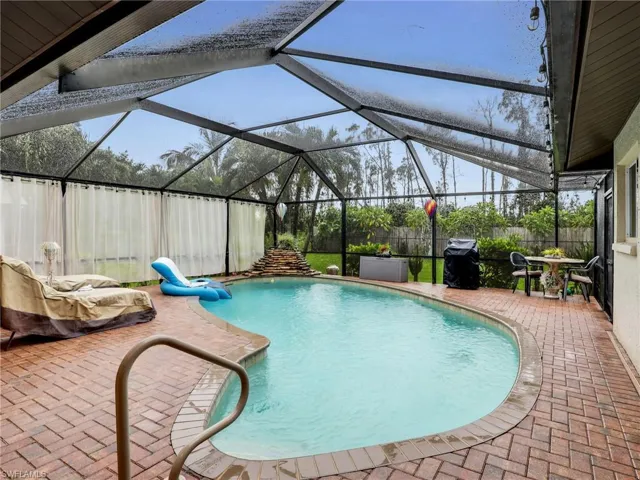 Kidney shaped pool with waterfall