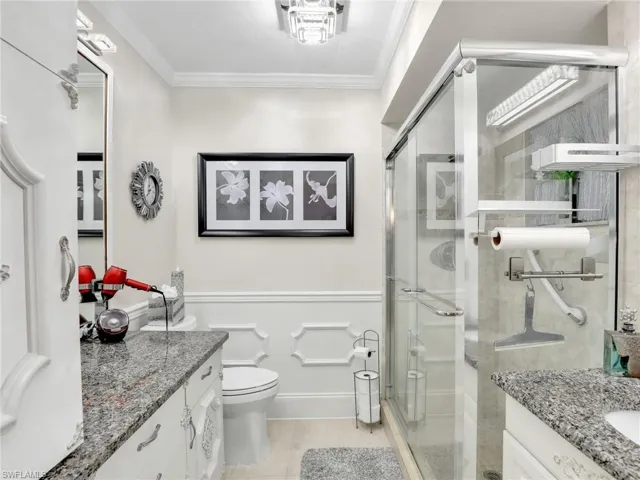 Bright bathroom with spacious walk-in, tiled shower