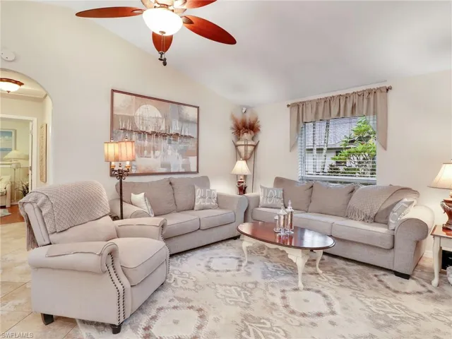 Family room with tile floors and cathedral ceiling