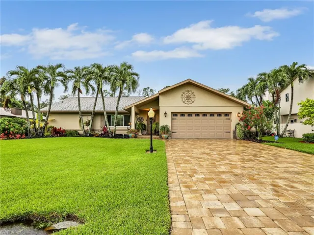 Beautiful home with newer paver driveway