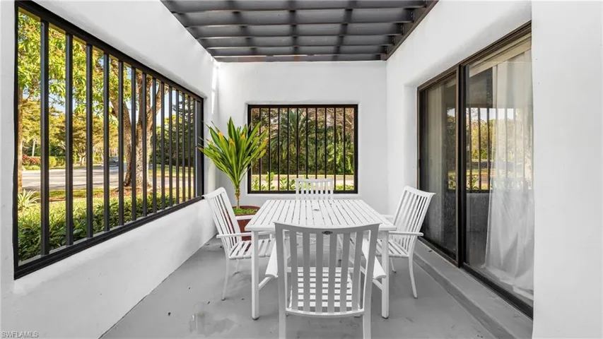 Sunroom / solarium with concrete flooring