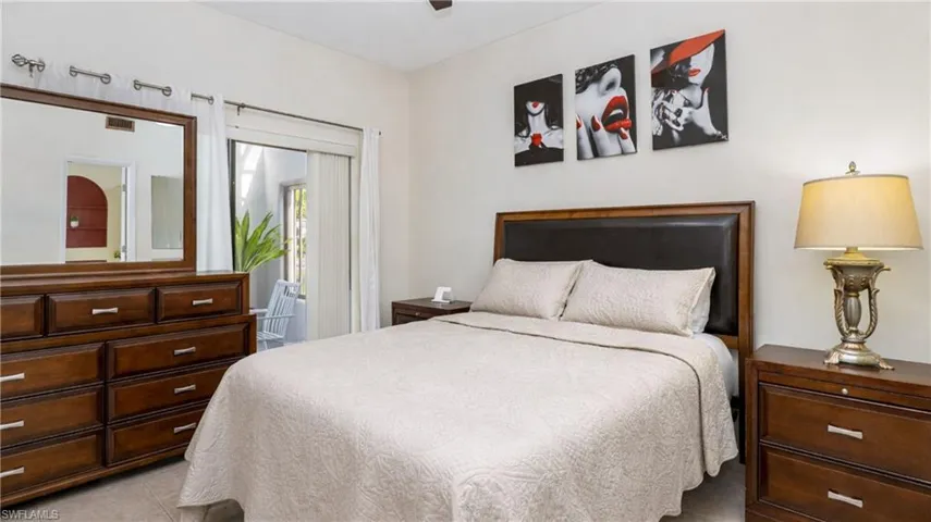 Bedroom featuring a ceiling fan and light tile patterned floors