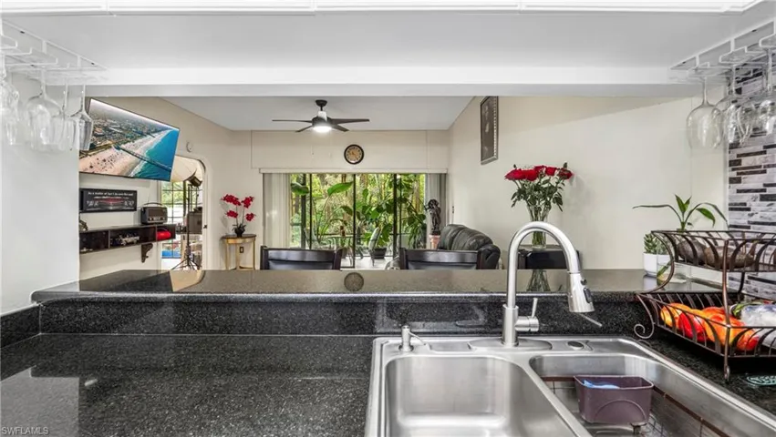 Kitchen with a sink and ceiling fan