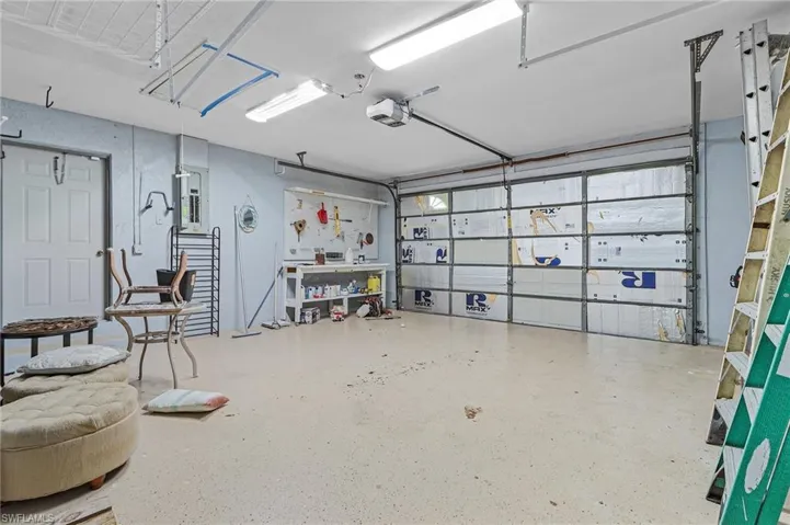 Extended sides 2 car garage with small workbench area