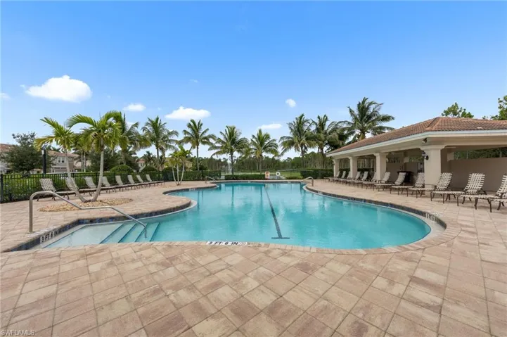 Community pool with a patio area