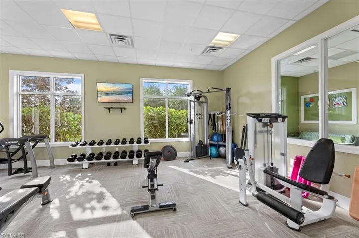 Workout area featuring a drop ceiling