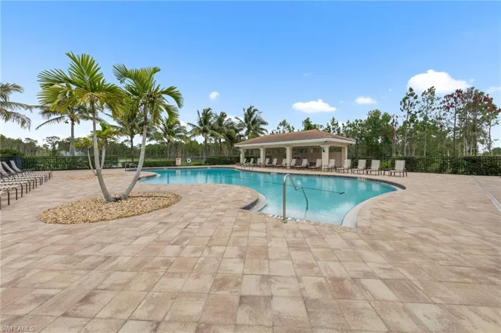 Community pool with a patio area