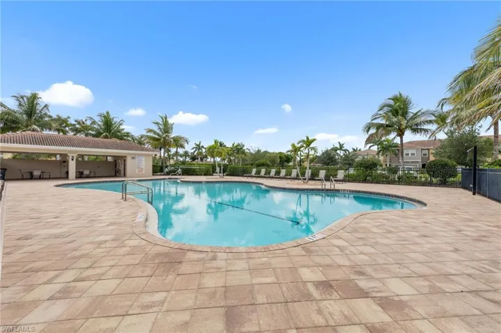 Community pool featuring a patio area