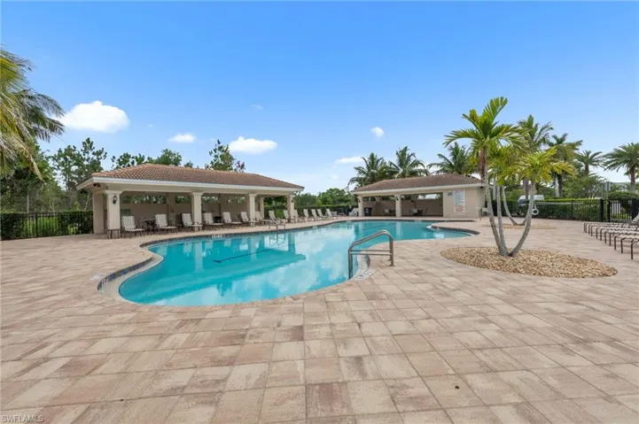 Community pool with a patio area
