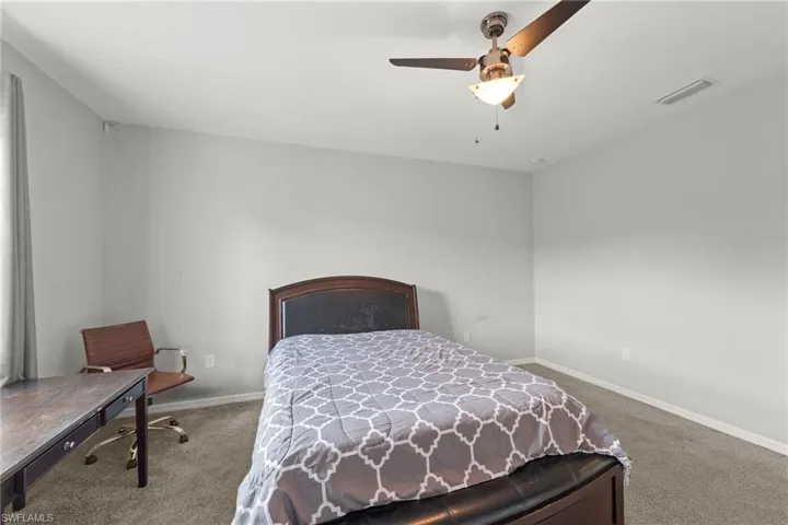 Bedroom featuring carpet floors and a ceiling fan