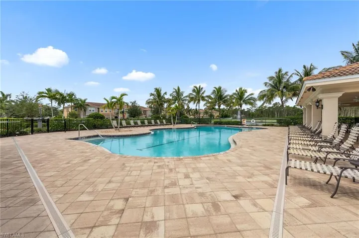 Community pool featuring a patio