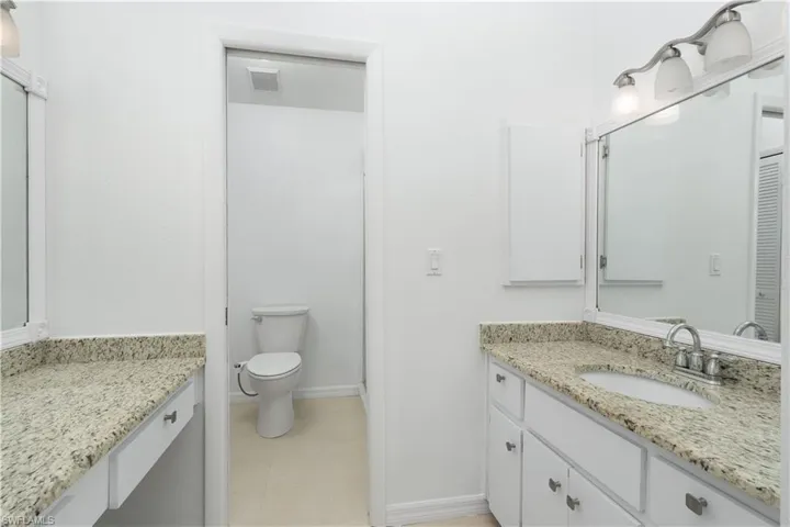 Primary Bedroom has private, en-suite bathroom with commode and walk in shower stall. Closet space as well.