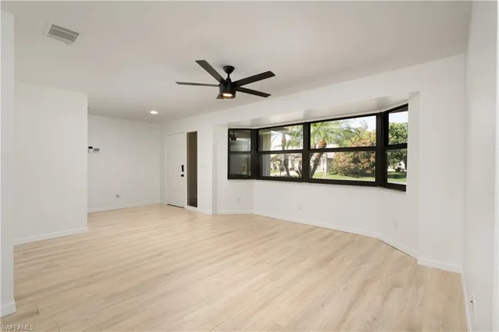 Great room area on the other side of kitchen. Multi-purpose. Can be a formal living area, formal dining, media room, or playroom.