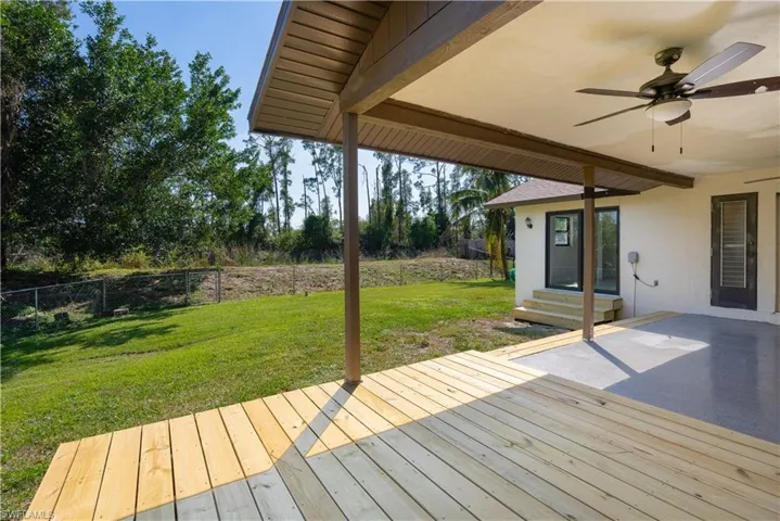 Views from the newly installed deck area facing the fenced in backyard.