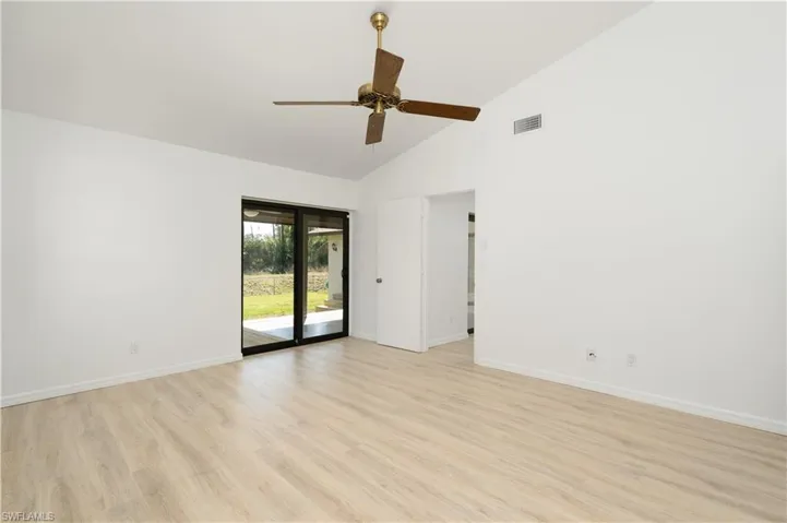 Primary Bedroom offers privacy and is split from guest bedroom areas. Has patio door leading to deck or your private oasis.