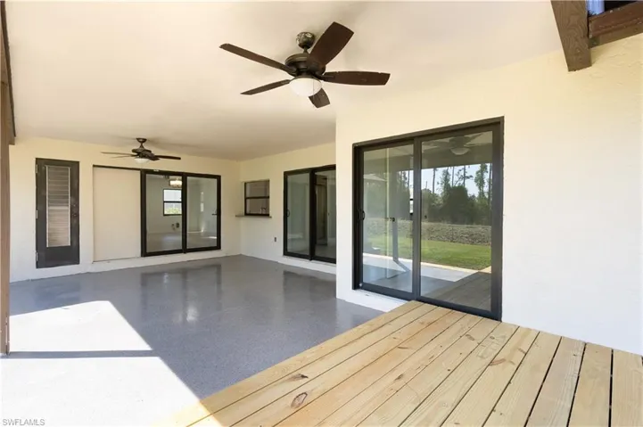 Raised wood deck (newly installed) would be a great spot for grilling or watching a game.