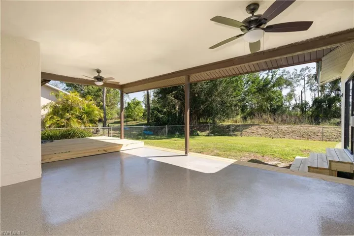 Expansive patio/deck area with new epoxy flooring and exterior painting/finishing.