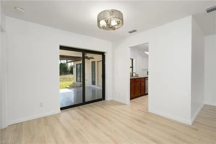 Great room area looking out towards kitchen/deck.