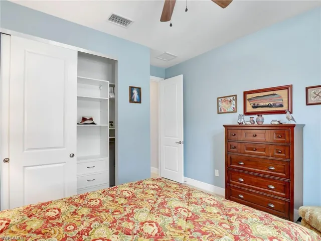 Bedroom with a closet and ceiling fan
