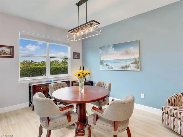 Dining room with light hardwood / wood-style floors