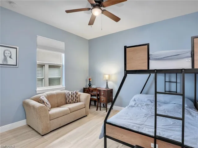 Bedroom featuring ceiling fan and light wood-type flooring