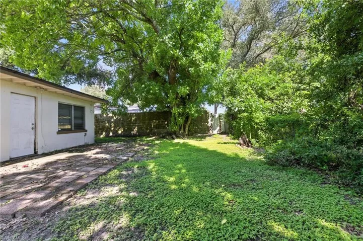 Fenced backyard featuring a patio