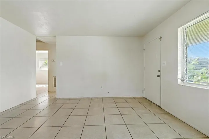 Spare room featuring light tile patterned floors