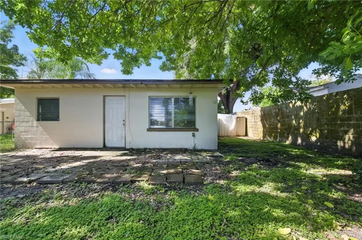 Back of property featuring stucco siding and a patio