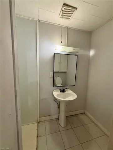 Bathroom featuring baseboards