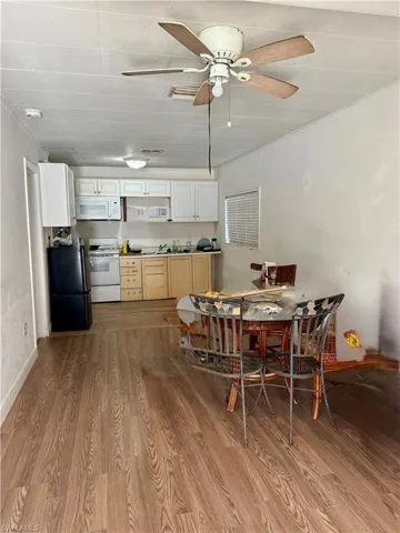 Dining room featuring light wood-style floors and a ceiling fan