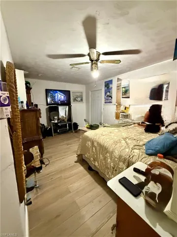 Bedroom with light wood-style flooring and ceiling fan