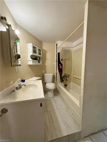Bathroom with shower / tub combination and vanity