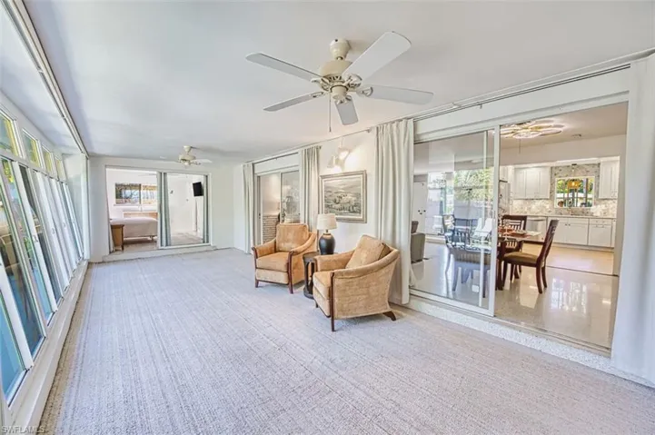 Sunroom with carpet flooring