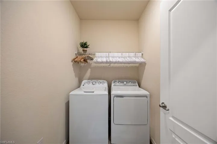 Washroom featuring washer and dryer