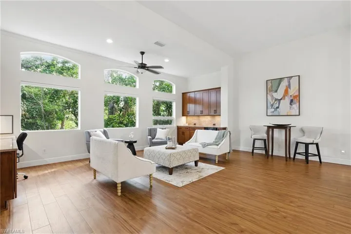 The high ceilings and beautiful impact windows allow natural light and all the biophilia feels with the preserve in the backyard.