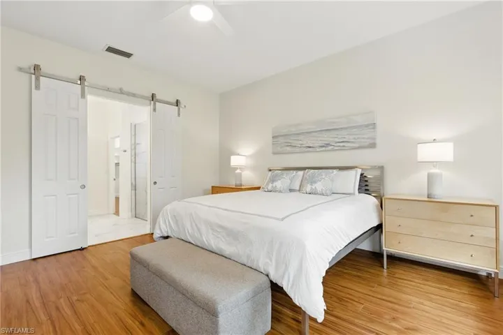 Barn doors invite you to a beautiful renovated bathroom suite