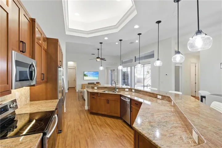 featuring stainless steel appliances, built in pull out shelving, and more