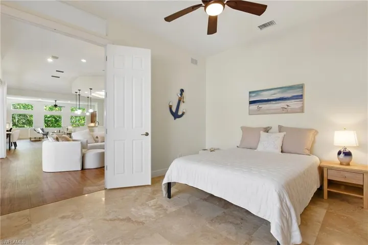 The french doors to this bedroom can easily close and provide plenty of privacy while also enjoying the view of the courtyard